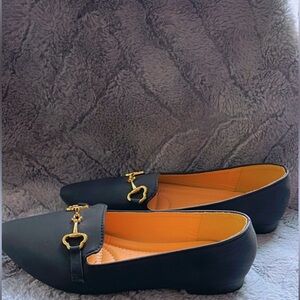 Wild Diva brand , size 5 black dress shoe with gold hardware.